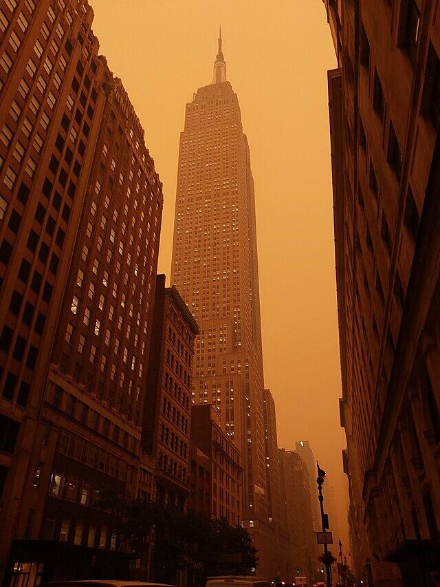 Empire State Building in New York in a yellow haze.
